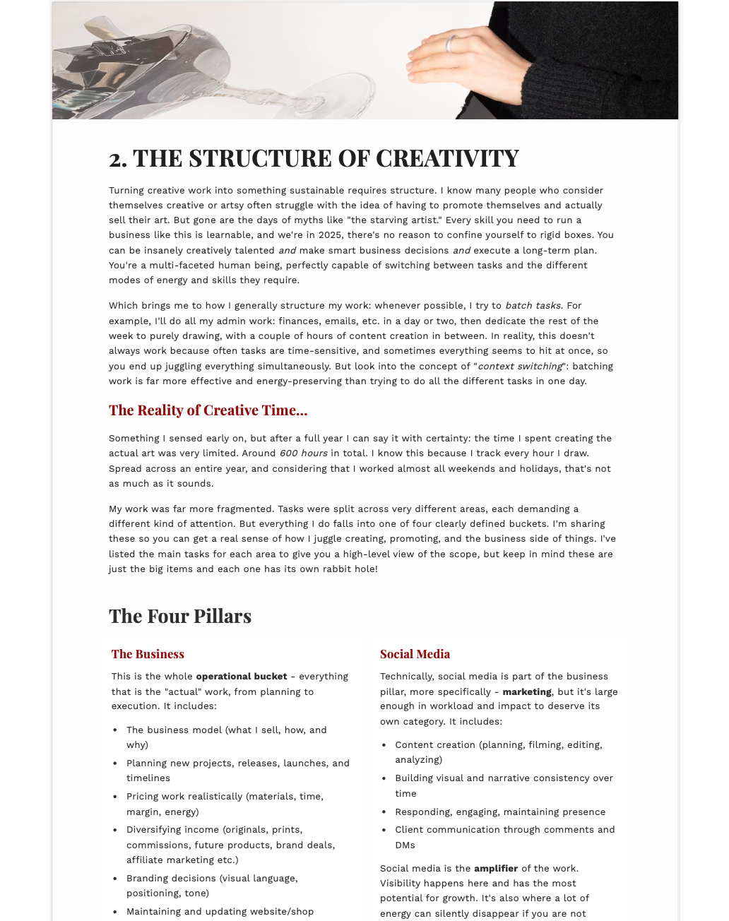 Page from a book or document titled 'The Structure of Creativity' with text and a hand holding a pen.